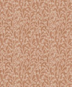 an orange and beige wallpaper pattern with small leaves on the bottom half of it