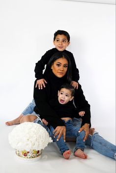 a woman and two children posing for a photo