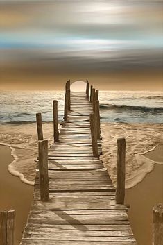 a long wooden pier extending into the ocean