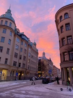 the sky is pink and purple in this city