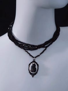 Embrace a touch of nostalgic elegance with our Vintage Black Cat Pendant Necklace. This exquisite piece features a charming black cat pendant that exudes a whimsical yet sophisticated vibe. The necklace is designed with multiple layers of delicate beaded chains, adding depth and a hint of sparkle to your ensemble. Perfect for pairing with your favorite sweater. Vintage Black Cat, Steampunk Fashion Male, Cat Pendant Necklace, Tie Necklace, Steampunk Accessories, Cat Pendant, Kawaii Jewelry, Gothic Accessories, Multi Layer Necklace