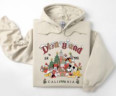 Vintage Disneyland Christmas Hoodie, Mickey and Friends Christmas Hoodie, Disneyland Hoodie, Christmas Family Hoodie, Christmas Gift PRODUCT DETAILS Our hoodies are meticulously crafted with attention to detail, featuring double-needle stitching on the collar, shoulders, armholes, cuffs, and hem. The 1 x 1 rib with spandex ensures a comfortable fit. Embrace the relaxed, unisex design made from a blend of 50% cotton and 50% polyester, offering both style and coziness. Safe Hooded Sweatshirt for Y Disneyland Hoodie, Mickey And Friends Christmas, Family Hoodie, Disneyland Christmas, Friends Christmas, Vintage Disneyland, Christmas Hoodie, Friend Christmas, Christmas Hoodies