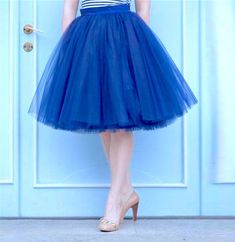 "Beautiful tulle skirt from soft Italian tulle for every day or special occasion. All skirts are made from 4-6 layers tulle, soft lining and elastic waistband for perfect fit and comfort. Each item are handmade and excelent quality. Usually tulle skirt sewing takes about 1 week. Shipping to US - 10 till 14 days, to UK - 5 till 7 days. If you need skirt for a specific date, please write it in the order notes. The model is 5.6ft tall and wears 26\" skirt length (6 layers). The length of the skirt Blue Tulle Skirt For Summer, Tulle Lined Flared Skirt, Blue Tulle Party Bottoms, Blue Tulle Bottoms For Spring, Tulle Midi Skirt With Lining, Spring Blue Tulle Bottoms, Midi Tulle Petticoat, Flared Tulle Skirt With Lining, Midi Tulle Skirt With Lining