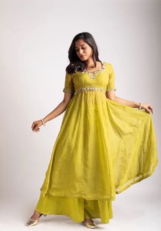 Anarkali suit usa / anarkali kurta full sleeve  / Indian dress with ombré dye/embroidered anarkali/Indian dresses / voggish / anarkali         Looking for a perfect indian dress/anarkali/suit sets that are trendy, unique and easy to carry !! yess, You are at the right place. we carry such versatile pieces of anarkalis and suit sets, kurtas that really let you stand out in any occassion !!      featuring this beautiful light mehendi green anarkali that has hand embroidery all over at the body and sleeves as shown paired with loose Polazzo / sharara pants as shown !! A very classy, beautiful yet unique look makes your occasion so Perfect !! Ready to ship in USA !! perfect for mehendi wedding outfit , can be customized in colors and patterns !! Details :  - color : light mehendi green   - Dre Anarkali Style Floor-length Pista Green Palazzo Set, Pista Green Anarkali Kurta With Gota Work, Green Floor-length Palazzo Set For Navratri, Pista Green Anarkali Kurta With Mirror Work, Maxi Length Sharara With Gota Work, Floor-length Gota Work Dresses For Diwali, Festive Gota Work Palazzo Set Maxi Length, Floor-length Green Kurta With Gota Work, Diwali Maxi Dress With Gota Work