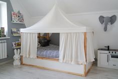 a bed with a white canopy over it