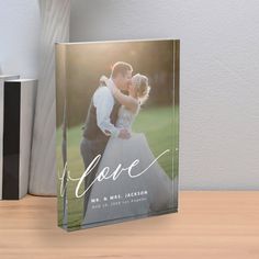 a wedding photo with the word love printed on it next to a couple's name