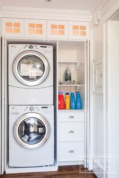 a washer and dryer are in the closet next to each other, which is built into the wall