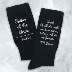 two black wedding socks with the words father of the bride on them