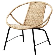 a wicker chair with black metal legs