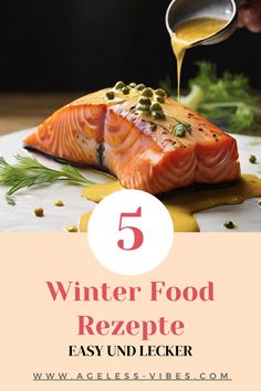 salmon being drizzled with mustard and seasoning on it, with the words winter food rezepte