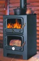 a wood burning stove in front of a log cabin