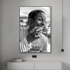 a black and white photo of a man eating food