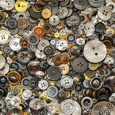 many different types and sizes of buttons are shown here in this image, there is no image to describe