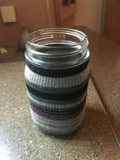 a glass jar sitting on top of a counter