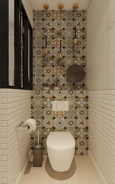 a bathroom with a toilet and tiled walls