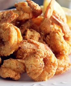 fried shrimp is served on a white plate