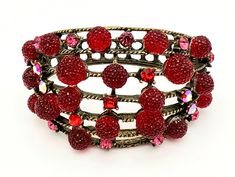 For your consideration is this fun funky red and brassy antique gold clamper hinge bracelet. This clamper bangle consist of brassy gold tone metal with red gum drop looking stones and pink crystal rhinestones . it is a hinged bracelet The inside diameter is 2 1/2 inches. width is 1/2 to 2 inch. length is 7 inches unsigned. the stones are intact and in good condition. the gold tone is in good condition Thank you very much for stopping by . Please feel free to email (CONVO) me with any questions o Gum Drop, Hinge Bracelet, Gold Confetti, Hinged Bracelet, Red Rhinestone, Rhinestone Bracelet, Vintage Bracelets, Pink Crystal, Gold Tone Metal