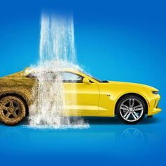 a yellow sports car with water coming out of it