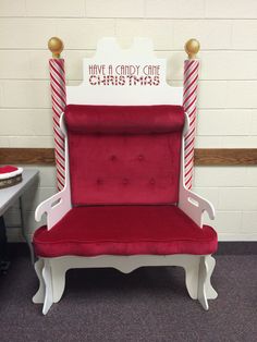 a red and white chair with candy canes on it