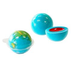 two blue balls and one red ball on a white background