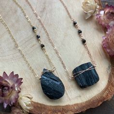 ~ Raw Black Tourmaline Necklace - Tourmaline Pendant - Raw Stone Necklace - Raw Crystal Pendant - Tourmaline Jewelry - Layering Necklace ~ Our gorgeous Tourmaline Necklaces feature genuine raw black tourmaline! Each raw crystal pendant differs in size and shape, so each necklace is  a one-of-a-kind beauty. The 17" chain is accented with petite tourmaline beads  positioned asymmetrically. A 2" extender allows you to wear this beauty from 17" - 19" long. Simple enough for layering with other pieces, but unique enough to stand on it's own! Please select the chain material from the following options: A. Oxidized Sterling Silver B. All Shiny Sterling Silver C. Gold Fill D. Rose Gold Fill If you'd like to see additional photos of any of the stones, please send me a message. --------------------- Wrapped Stones, Raw Crystal Pendant, Black Tourmaline Necklace, Jewelry Layering, Raw Black Tourmaline, Raw Stone Necklace, Spiritual Stuff, Labradorite Bracelet, Tourmaline Pendant