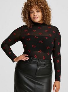 FIT Model is 5'10. 5” wearing size 1. . Measures 30” from shoulder. . MATERIALS + CARE Mesh knit fabric. 95% nylon, 5% spandex. Machine wash cold. Tumble dry low. . Imported. . DETAILS Mock neckline. Long sleeves. . The best plus size women's mesh mock neck long sleeve top tops in outline toss bows deep black made of mesh. Torrid is your destination for cozy fall and winter clothes to keep you warm and comfortable. Black Mesh Top Outfit, Mesh Top Outfit, Plus Size Long Sleeve Tops, Black Mesh Top, Mock Neck Long Sleeve, Corset Crop Top, Plus Size Fits, Mock Neckline, Knit Fashion