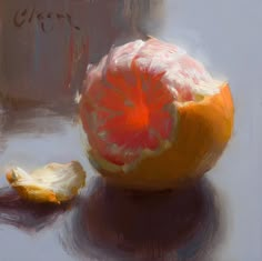 an orange is sitting next to a piece of fruit