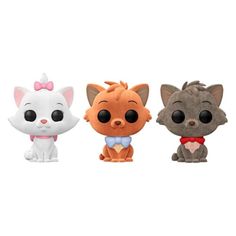 three small figurines of cats with bows on their heads