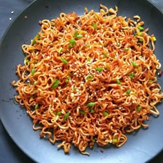 a plate full of noodles with sesame seeds