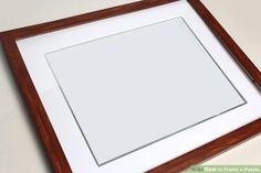 a wooden frame with a white paper in the middle and a brown border around it