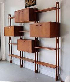 a wooden shelf with many drawers on it