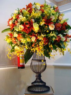 a vase filled with flowers sitting on top of a table