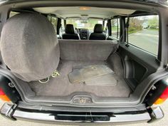 the back seat of a car with its trunk open