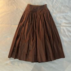 Vintage Saint Laurent Rive Gauche Brown Cotton Skirt. This Is A Full Midi Length Skirt (Full Length On A Short Frame) With A Yoke And Full Pleated Skirt. It Is Lined With Brown Rayon Skirting To Help Support The Shape And Fullness. A Beautiful True Vintage Designer Piece In Size 38, Which Correlates To An Extra Small. Measurements (Laying Flat): Waist 12” Yoke 16” Length 35” Daywear Long Lined Wrap Skirt, Long Wrap Skirt With Lining For Daywear, Long Lined Wrap Skirt For Daywear, Fitted Skirt With Pleated Waist For Daywear, Fitted Pleated Waist Skirt For Daywear, Daywear Lined Wrap Skirt, Brown Full Skirt With Gathered Detail, Lined Voluminous Wrap Skirt, Brown Gathered Long Skirt