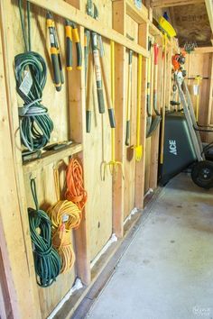 there are many tools hanging on the wall