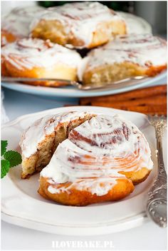 two plates with pastries on them and one has a bite taken out of it