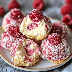 some raspberry filled pastries on a plate