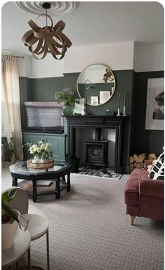 a living room filled with furniture and a fire place in the middle of the room