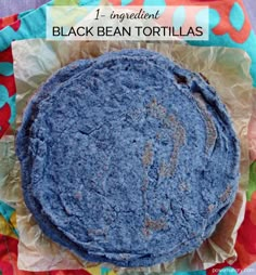 a blue tortilla sitting on top of a piece of paper