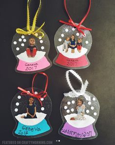 three personalized christmas ornament hanging on a blackboard with red, white and blue ribbon