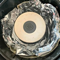 an empty frying pan covered in aluminum foil