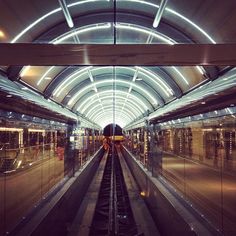 a train traveling through a tunnel with lots of lights