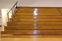 the stairs are made of wood and have metal handrails