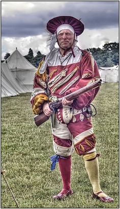 a man dressed in an old time costume