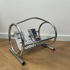 a magazine rack sitting on top of a wooden floor