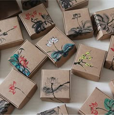 several boxes with designs on them sitting on a table