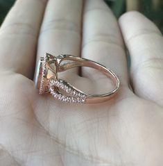 "An oval-shaped natural and genuine Opal set in a bezel setting accented with petite white sapphires handcrafted in your choice of 10k/14k/18k Rose/Yellow Gold or White Gold. This ring makes a lovely engagement/promise/October birthstone/statement ring. Wrapped in a Box ready for gift giving.(r-egt-20) Please note each opal has a unique play of color, if you wish for a certain color in the fire, please let us know and we will try to accommodate your request. View our Instagram video of this Ring Oval Sapphire Ring With Rose Cut Diamonds For Promise, Emerald-cut Rose Gold Sapphire Ring With Accent Stones, Emerald-cut Sapphire Ring In Rose Gold With Accent Stones, Rose Gold Emerald-cut Sapphire Ring With Accent Stones, Oval Birthstone Ring With Rose Cut Diamonds For Promise, Promise Oval Birthstone Ring With Rose Cut Diamonds, Marquise Cut Center Stone Jewelry For Proposal, Emerald Cut Rose Gold Jewelry With Halo Design, Rose Gold Halo Setting Ring As A Gift