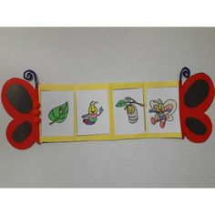 four butterfly cut outs are displayed on a white wall with red and yellow trimmings