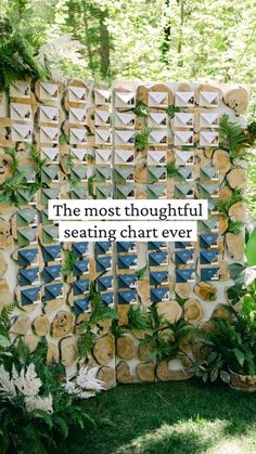 the most thoughtful seating chart ever is made out of wood slices and other pieces of paper