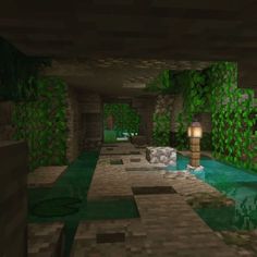 an empty room with green plants on the walls and a pool in the middle that has water running through it